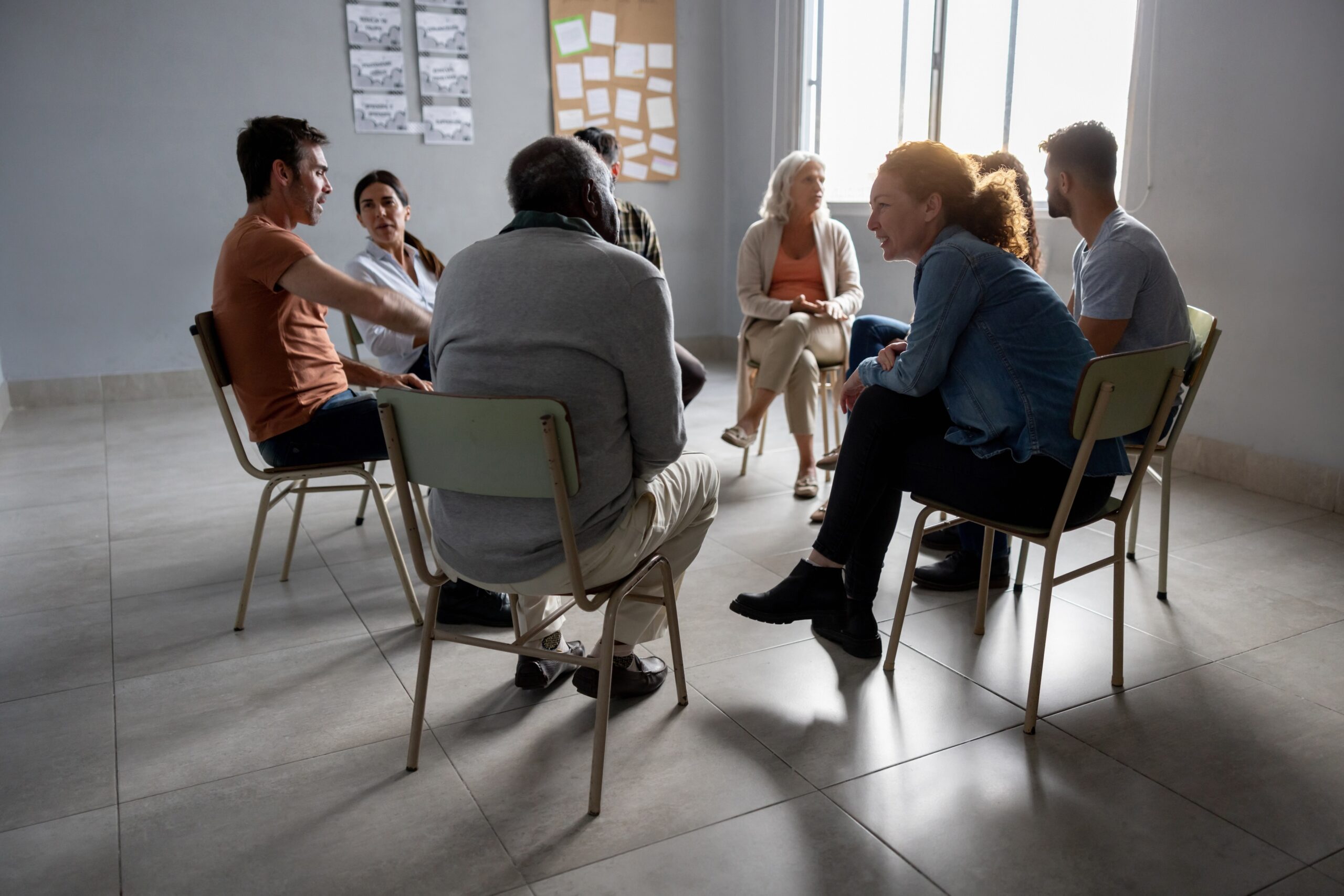 Adults participating in a supportive group conversation